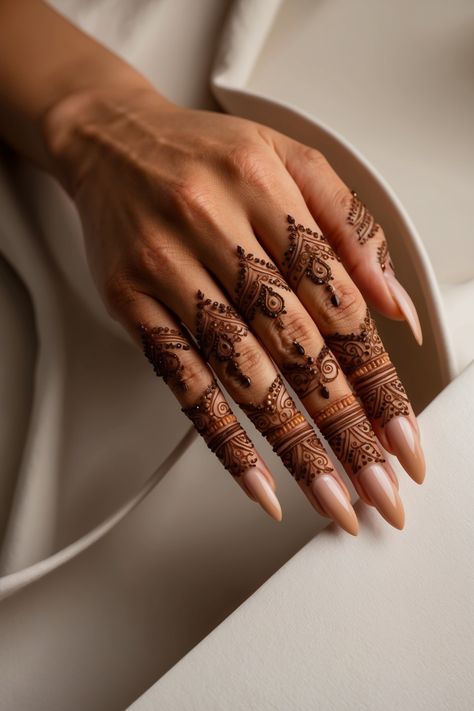 Discover this stunning back hand simple mehndi design that beautifully highlights the fingers with intricate patterns and fine details. Perfect for minimalistic looks, casual events, or elegant gatherings, this design adds a sophisticated touch without being too elaborate. Ideal for those who love clean, geometric lines combined with delicate dots and traditional motifs Mehndi Design For Fingers, Back Hand Simple Mehndi Design, Henna Main, Back Hand Simple Mehndi, Minimalist Henna, Hand Simple Mehndi Design, Fingers Mehndi Design, Finger Mehandi, Mendhi Patterns