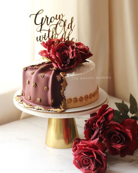 Timeless elegance captured in cake form ✨ This ‘Grow Old with Me’ creation combines rich maroon and delicate white, accented with golden details for a truly luxurious look. Perfect for anniversaries or any special occasion where love takes center stage. Every detail, hand-crafted with care at The Baking Mumma 💕 Looking for a bespoke cake that tells your unique story? WhatsApp to order your custom design today! 🎂🍰 #TheBakingMumma #LuxuryCakes #CustomCakeDesign #HomeBakerLife #AnniversaryCakes Maroon Cake, Wedding Cakes Maroon, Cake Form, Grow Old With Me, Indian Theme, Wedding Backdrop Design, Grow Old, Theme Cake, 10 Year Anniversary