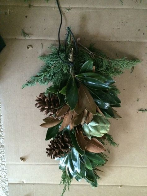 How to make a natural Christmas swag Porch Light Swag Diy Christmas, Christmas Door Swags Diy, Evergreen Swag, Magnolia Branch, Christmas Swag, Door Swag, Best Christmas Presents, Magnolia Leaves, Natural Christmas