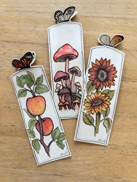 Beautifully detailed bookmarks measuring approximately 6.5x2 inches, including 3d butterfly. Bookmarks are made of high quality watercolor paper and thick cardstock for strong durability. Handdrawn and handpainted, these bookmarks are each unique, made special for you! By Chloe Making Your Own Bookmarks, Watercolor Crafts To Sell, Fall Arts And Crafts For Adults, Bookmark Collage, Breaks Books, Cute Diy Bookmarks, Bookmarks Handmade Creative, Diy Watercolor Bookmarks, Unique Bookmarks Handmade