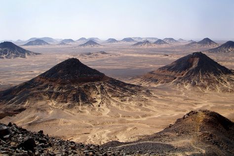 Black Desert, Egypt  Egypt's deserts come in many colors, including Black... Black Rock Desert, Deserts Of The World, Desert Tour, Black Desert, Visit Egypt, Cheap Hotels, Luxor, Amazing Destinations, The Desert