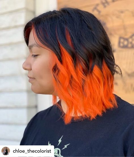 Gorgeous orange and black hair color for Halloween. Are you ready to get spooky? Whether you're looking for fun hairstyles for Halloween or Halloween hair color ideas, you'll get some serious hair inspo from this post! Here are 31 of the coolest, most creative Halloween hairstyles on the planet!