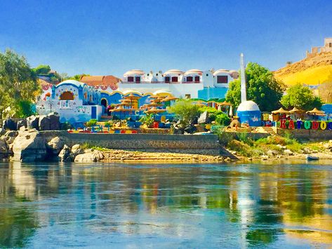 Beautiful Aswan and Nuba in Egypt, spectacular Nile view and kind people of Nuba, beautiful colored houses over the Nile #egypt #aswan #travel #tourism #relaxing Aswan Egypt Nubian, Nuba Egypt, Nubia Egypt, Egypt Aswan, Nubian Village, Nile Egypt, Colored Houses, Nubian Heritage, Nile River Cruise