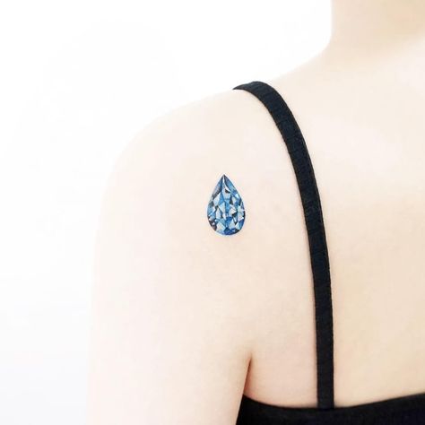 Tear drop jewel tattoo by Tattooist Ida #TattooistIda #Ida #jeweltattoos #color #realism #realistic #hyperrealism #teardrop #blue #jewel #gem #crystal #watercolor #tattoooftheday Jewel Tattoos, Water Drop Tattoo, Teardrop Tattoo, Tattoos 2022, Diamond Tattoo, Gem Tattoo, Filigree Tattoo, Jewel Tattoo, Crystal Tattoo