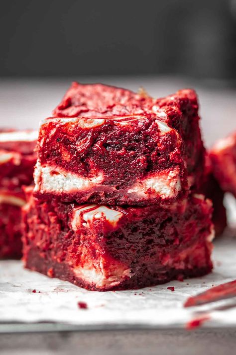 Homemade red velvet brownies feature a sweet and tangy cream cheese swirl, creating a moist and chewy texture. With the vibrant red color, these brownies are an ideal treat for Valentine's Day, with all the classic flavors of traditional red velvet cake, enhanced by oil for moisture, cocoa powder for depth, and a creamy cheesecake filling swirled into the batter. Traditional Red Velvet Cake, Red Velvet Bars, Brownies With Cream Cheese, Velvet Desserts, Summer Potluck Recipes, Red Velvet Cheesecake Brownies, Cake Mix Brownies, Cocoa Powder Brownies, Red Velvet Desserts