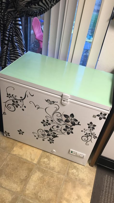 DIY painted chest freezer. Acrylic paint and decals can go a long way. Freezer Cover Up Chest, Hide Chest Freezer In Kitchen, Paint Deep Freezer, Chest Freezer Makeover, Deep Freezer Makeover, Hiding A Deep Freezer, Freezer Decor, Freezer Makeover, Hiding Appliances