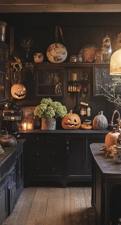 Create a vintage-inspired Halloween kitchen with nostalgic decor. Display retro Halloween postcards on a bulletin board. Arrange a collection of antique candy tins on open shelves. Hang a string of vintage-style Halloween lights above the window. Add charm with a black cat clock on the wall. Place a bowl of old-fashioned candy corn on the counter. This Halloween kitchen decor evokes the warmth and whimsy of Halloweens past while creating a cozy space for modern celebrations. Kitchen Window Halloween Decor, Dark Cottagecore Halloween, Halloween Display Board, Top Of Cabinet Halloween Decor, Vintage Kitchen Counter Decor, Vintage Halloween Room, Witchcore Kitchen, Halloween Counter Decor, Halloween Interior Design