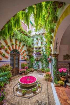 Patio in Cordoba, Spain.  Cordoba is a faithful reflection of the powerful civilizations that have settled there.  Romans, Moors, Jews and Christians have left a deep mark on its heritage, culture, traditions and customs. Ancient Buildings Architecture, Morocco Hotel, Moroccan Houses, Beautiful Vacation Destinations, Cordoba Spain, Persian Garden, Persian Architecture, Rooftop Design, Architectural Sculpture