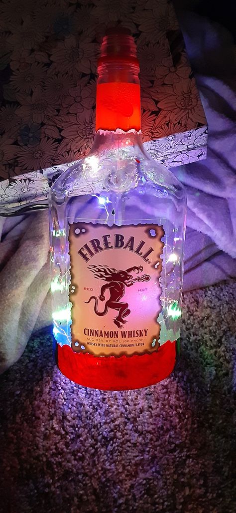 Upcycled Fireball bottle, painted, with 20 LED fairy lights installed. Glass Alcohol Bottles, Liquor Bottle Crafts Diy Ideas, Bedazzled Bottles, Fireball Bottle, Alcohol Decor, Glitter Bottles, Bedazzled Bottle, Bottle With Lights, Mermaid Canvas