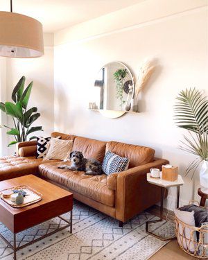 Check out this look I found on LIKEtoKNOW.it http://liketk.it/2RpYM  Download the LIKEtoKNOW.it app to see! Mirror Behind Couch Living Rooms, Kitchen Decor Cozy, Cottagecore Kitchen Decor, Tan Sofa, Brown Leather Couch, Home Decor Aesthetic, Home Design Inspiration, Aesthetic Home Decor, Living Room Flooring