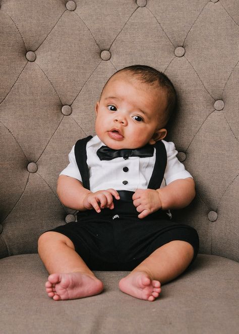 This baby tuxedo bodysuit with black suspender shorts and black accents is the perfect outfit for a warm weather christening or baby blessing. Great reviews! Baby Wedding Outfit Boy, Baby Tuxedo, Baby Wedding Outfit, Christening Outfits, Baby Boy Christening Outfit, Boy Christening Outfit, Boy Baptism Outfit, Boys Tuxedo, Black Baby Boys