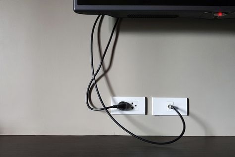 How To Hide TV Wires and Improve the Look of Your Living Room Hide Outlet, Hide Electrical Cords, Hide Tv Cords, Outlet Placement, Tv Cords, Electrical Outlet Covers, Hidden Tv, Tv Wand, Diy Techniques