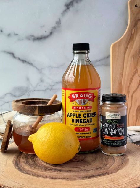 This hot apple cider vinegar detox drink is robust and comforting. Made with apple cider vinegar, lemon, honey and cinnamon for a flavorful warm tea. Skip the chill with a spicy-sweet ACV tea! #applecidervinegardrink #hotapplecidervinegartea #acvtea #acvdrink Keto Apple Cider Vinegar Drink, Detox Apple Cider Vinegar Drinks, Apple Cider Vinegar Tea Sore Throat, Apple Cider Vinegar Cinnamon Lemon Drink, Vinegar Drinks Apple Cider, Hot Apple Cider Vinegar Drink, Apple Cider Detox Drink, Apple Cider Vinegar Night Drink, Apple Cider Vinegar Drink For Colds