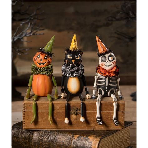 Don't be a scaredy cat! Boo Party Kitty by LeeAnn Kress is just as sweet as can be. She has moveable joints so she can be seated or positioned anywhere in your house or on your shelves. You will love the details on this captivating kitty! Dimensions: 2.5" X 2" X 10" Halloween Figurine, Boo Party, Pumpkin Vine, Nutcracker Decor, Bethany Lowe Designs, Halloween Figures, Scaredy Cat, Tinsel Tree, 2024 Halloween