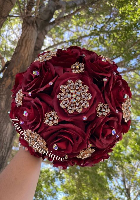 An elegant and beautiful bouquet! Customize bouquets are also available if needed. Different colors and brooches. 10inches in diameter You are welcome to message me and I will reply quick :) Hablo español 😊 Red Quinceanera Bouquet, Red Quince Bouquet, Red Quince Makeup, Burgundy Quince, Red Quinceanera Theme, Red Quince Theme, Quince Bouquet, Beauty And The Beast Quince, Quince Planning