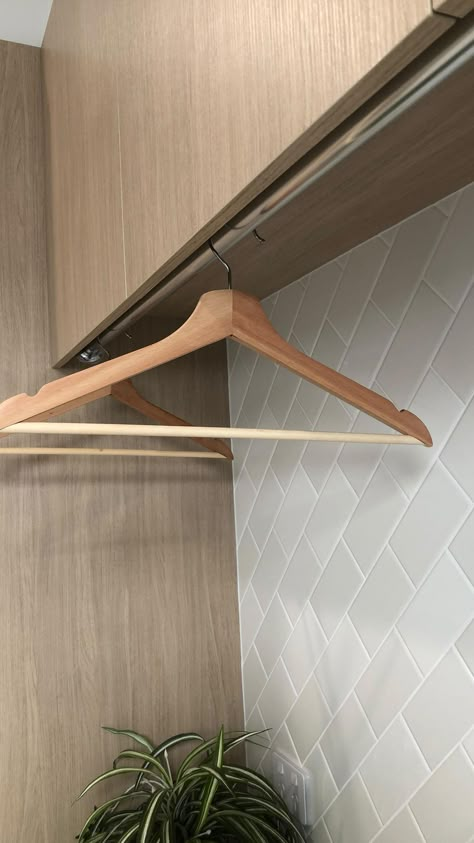 Laundry Rail Hanging Clothes, Hanging Clothes Line In Laundry Room, Hidden Hanging Rail Laundry, Hanging Shelf Clothes, Laundry Hanging Rod Ideas, Hanging Rail Laundry, Small Laundry With Hanging Rail, Laundry With Hanging Rail, Laundry Clothes Hanging Ideas