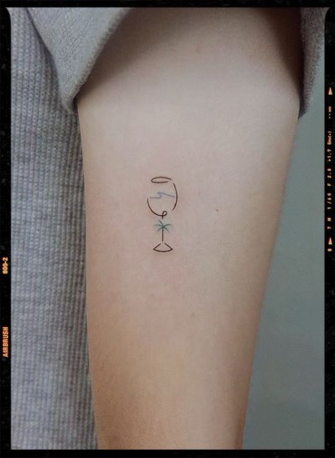 The Art of Travel: Exploring the World of World Traveler Tattoos | Aesthetic & Unique Tattoo Ideas Wine Glass Wave Tattoo, Tropical Vacation Tattoo, Wine Tatoos Glasses, Mini Wine Glass Tattoo, Small Wine Tattoos, Wine Tattoo Minimalist, Holiday Tattoo Ideas Summer, Wine Tattoos For Women, Wine Glasses Tattoo