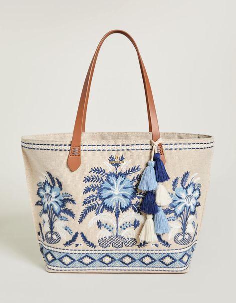 The best party is a beach party and our Fiesta Tote is always ready to come along! Decorated with palm tree embroidery on a cotton and jute blend, this tote features a fun, tiered tassel fob and a faux leather bottom base to keep it dry. The custom patterned cotton interior features 2 slip pockets and 1 hanging zipper Palm Tree Embroidery, Lowcountry Style, Stylish School Bags, Tree Embroidery, Embroidered Quilts, Quilted Tote Bags, Best Party, Quilted Totes, Pretty Bags