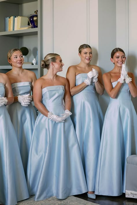 Chic and refined! These bridesmaids shine in their powder blue gowns and delicate gloves, a nod to timeless elegance. ✨ Explore more ideas like this on Style Me Pretty!   Photography: Caroline Eliza Co. (http://carolineeliza.co) Powder Blue Bridesmaid Dress, Bridesmaid Theme, Light Blue Bridesmaids, Bridesmaid Colours, Powder Blue Gown, Lemonade Wedding, European Romance, Bridesmaids Looks, Powder Blue Wedding