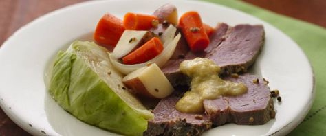 Celebrate St. Patrick’s Day – or the luck of the Irish every day – with this slow-cooker corned beef and cabbage dinner. A perfectly seasoned corned beef is the best Irish dinner, and this is no exception – simmered in beer, served with potatoes, carrots, and onions, and topped with an applesauce and Dijon sauce, this St. Paddy’s tradition is the perfect celebratory meal. Boiled Dinner Recipe, Cabbage Boiled, Cabbage Slow Cooker, Boiled Dinner, Slow Cooker Corned Beef, Corn Beef, Corned Beef And Cabbage, Corned Beef Recipes, Reuben Sandwich