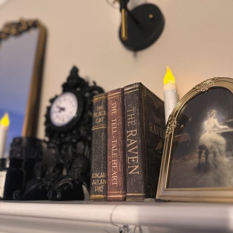 Stack of books 📚 for 100 Days of Halloween Happy 🖤 The current decor theme for my mantle is Dark Academia so this stack of Poe titles fit right in! The second picture is from before my living room was renovated - I still have the books displayed in my living room, just in different spots! #darkacademia #mantledecor #halloweenhomedecor #gothicdecor Dark Academia Mantle, Blue Academia, Antique Library, Witchy Room, Academia Decor, Dark Academia Decor, Library Study, Dream Library, Dark House