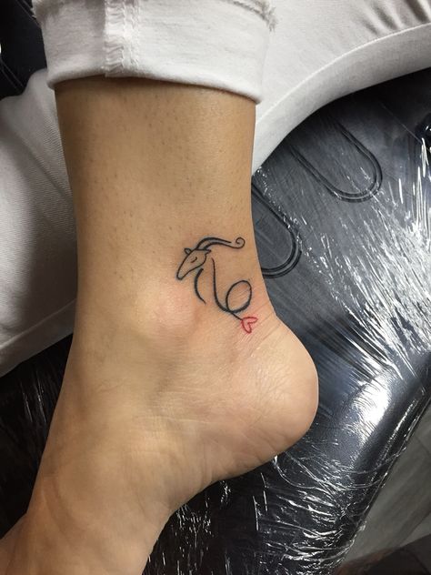 Capricorn #smalltattoo #ankletattoo Capricorn Finger Tattoos For Women, Mini Capricorn Tattoo, Capricorn Aquarius Cusp Tattoo, Capricorn Simple Tattoo, Capricorn Tattoo Minimalist, Capricorn Neck Tattoo, Capricorn Inspired Tattoos, Red Capricorn Tattoo, Capricorn Sign Tattoo For Women