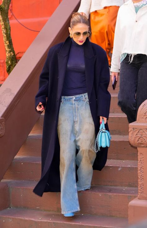 Jennifer Lopez Sends a Message in a Crop Top and $6,300 Dior Basket Bag | Marie Claire Amina Muaddi Outfit, All Blue Outfit, Best White Shirt, Jennifer Lopez Outfits, Low Rise Baggy Jeans, Celebrity Look Alike, Amina Muaddi, Slogan Tee, Denim Trends