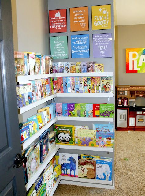 Easy display shelving creates a library-like air in a playroom. | 41 Clever Organizational Ideas For Your Child's Playroom Library Corner, Basement Playroom, Boys Playroom, Childrens Library, Comfy Pillows, Playroom Organization, Kids Room Organization, Salou, Toy Rooms