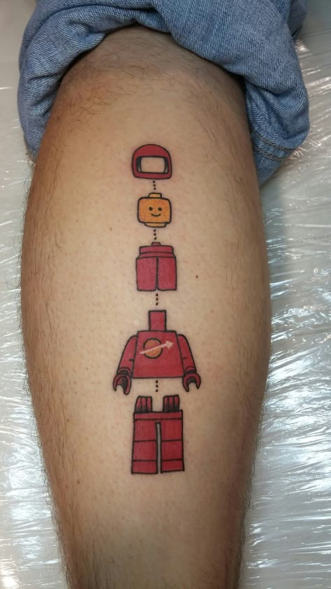 LEGO Minifig Tattoo Lego Minifigure Tattoo, Lego Brick Tattoo, Lego Tattoo Ideas, Police Tattoo, Lego Tattoo, Iron Man Tattoo, Astronaut Tattoo, Circle Tattoos, Landscape Tattoo