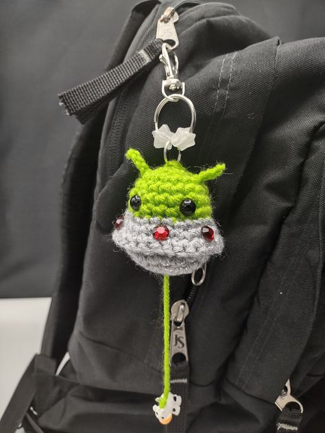 This little guy is a great attention getter and conversation starter! Very unique and funny! Crochet Glow In The Dark Patterns, Glow In The Dark Yarn Crochet Patterns, Weird Things To Crochet, Alien Abducting Cow, Crochet Ideas Keychain, Glow In The Dark Crochet, Cool Gifts For Guys, Space Crochet, Crochet Alien