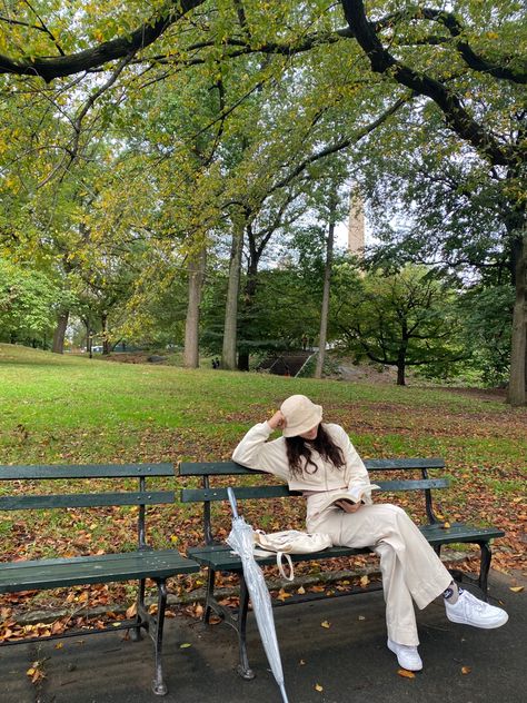 womens fashion, central park, fall outfit, reading in the rain, beige outfit, monochrome Walk In The Park Photoshoot, Fall Park Outfits, Central Park Fall Outfit, Park Shoot, Central Park Outfit, Reading At Park Aesthetic, Park Reading Aesthetic, Beige Monochrome Outfit, Central Park Aesthetic Fall