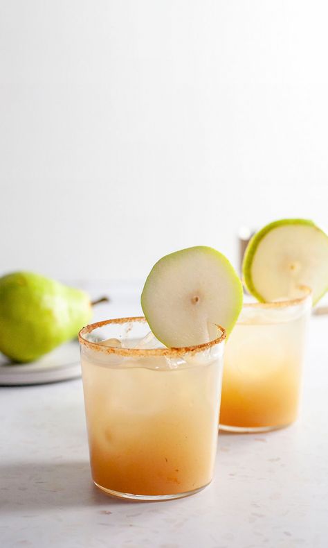 We believe that you can drink margaritas all year round. This is the perfect margarita for winter with just the right amount of warmth and spice.  #tequila #cocktail #recipe #margarita #winter Winter Margarita, Pear Tequila Cocktail, The Perfect Fall Margarita, Fall Inspired Margaritas, Tequila Winter Cocktails, Harvest Pear Margarita, Pear Vanilla Cocktail, Apple Cider Mezcal Margarita, Pear Ginger