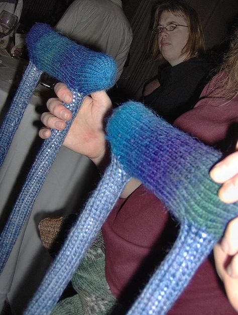 Knitted crutch covers.  There's nothing that a little knitting can't improve! Crochet Crutch Cover, Crutch Covers, Sock Hop, Crocheting Projects, Mobility Aids, Crutches, Art Shows, Art Show, Fiber Art