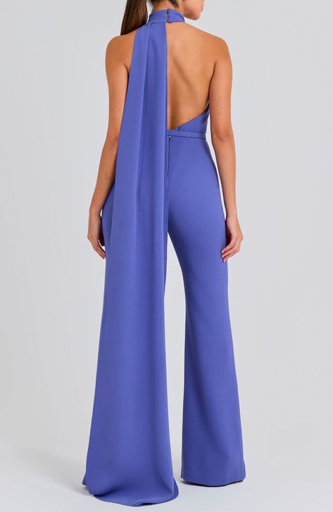 An open back and a halter neck bring flirty appeal to this wide-leg jumpsuit with a drapey detail that flows down the back of this belted jumpsuit. 63 1/2" center front length; 34 1/2" inseam; 26" leg opening (size 8) Hidden back zip; keyhole with button-and-loop closure Halter neck Sleeveless, with cutaway shoulders Removable belt Stretch lining 100% polyester Dry clean or hand wash, dry flat Imported Chic Halter Neck Jumpsuit For Night Out, Elegant Formal Halter Neck Jumpsuits, Jumpsuit Formal, Evening Wide-leg Fitted Jumpsuit, Glamorous Halter Neck Jumpsuit, Luxury One-shoulder Elegant Jumpsuit, Fancy Jumpsuit, Black Lace Jumpsuit, Jumpsuit For Wedding Guest