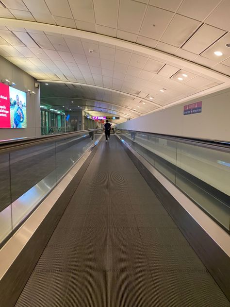 Airport escalator at night with signs in the back Airport Terminal Aesthetic, Airport Escalator, Airport Aesthetic, Jfk Airport, Park Street, Airports Terminal, Midtown Manhattan, At Night, Manhattan