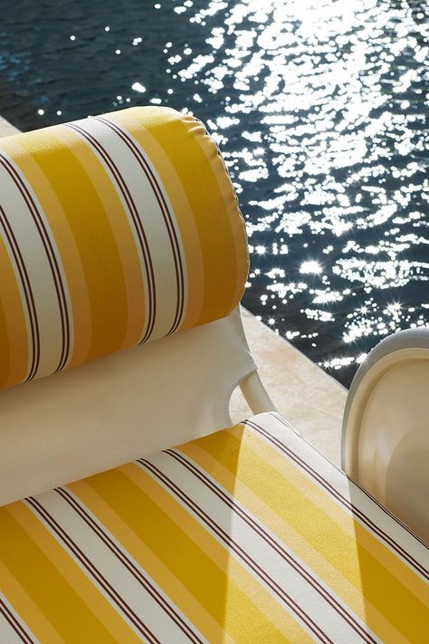 From the Jacquemus + Exteta collaboration emerges a special re-edition of the Locus Solus collection, originally designed by Gae Aulenti in the 1960s. With the outdoor chaise lounge and deck chair, covered in yellow-striped fabric, Jacquemus pays homage to the vibrant beach air mattresses and umbrellas of the 1980s, capturing the vintage essence of this iconic design. Pool Chaise Lounge, Gae Aulenti, Pool Umbrellas, Air Mattresses, Pool Lounge, Sunny Afternoon, Hotel Pool, Olive Trees, Pool Bar