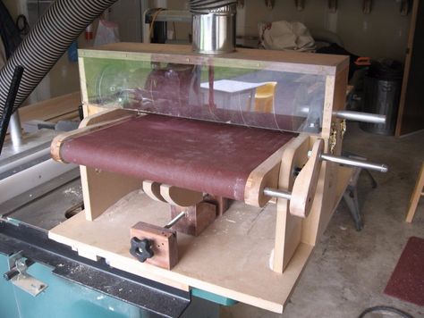 Thickness Drum Sander by John Abbett -- Homemade thickness drum sander powered by a 3 HP table saw. Constructed from hardboard, 3/4" shaft, threaded rod, pulleys, belt, bearings, and hardware. http://www.homemadetools.net/homemade-thickness-drum-sander Shopsmith Projects, Homemade Drum, Homemade Machine, Drum Sander, Workbench Plans Diy, Workbench Plans, Garage Work Bench, Wood Shop Projects, Belt Sander