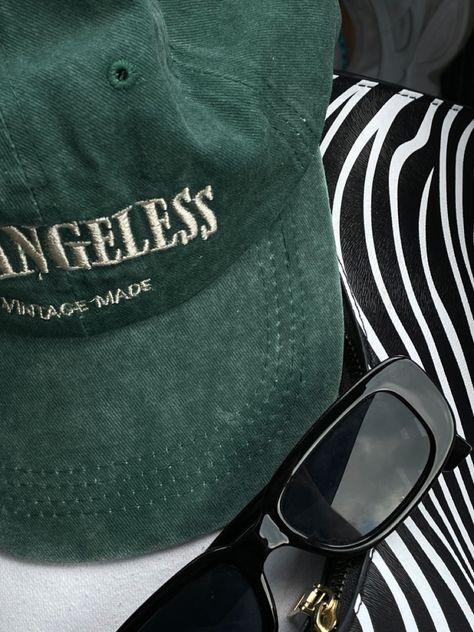 green vintage cap, a pair of black sunglasses and a zebra bag. picture taken in a car. #aestheticlypleasing #aesthetic #fashion #trendy #trendystreetstyle #fillerpic filler pic #vintagestyle #vintageaesthetic #ootd #ootdfashion Cap Pictures Aesthetic, Green Cap Aesthetic, Green Hat Aesthetic, Cap Aesthetic, Zebra Bag, Anything Aesthetic, Bag Picture, Rich Rich, Cali Trip