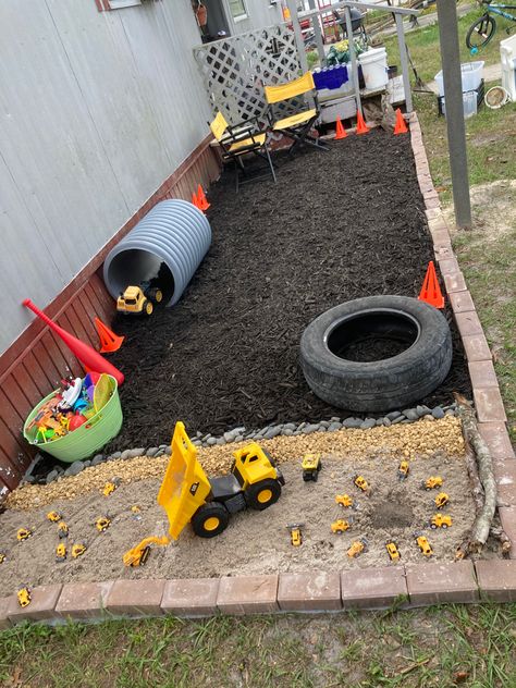 Can’t wait for my grandson to come over to play. Cheap mulch, sandbox sand and rocks. Added some bricks for a border. Got a sun shade to add too. Outdoor Sandbox Ideas, Large Sandbox Ideas, Alternative Sandbox Ideas, Kids Sandbox Ideas, Sand Pit Ideas Play Areas, Sandbox Alternative Ideas, Kids Digging Area, Outdoor Digging Area For Kids, Backyard Sandbox Ideas