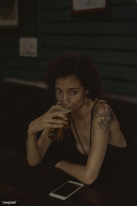 Lone woman having a beer at a bar | premium image by rawpixel.com Beer Night, Phone Technology, Beer Art, Beer Pub, Women Talk, Human Poses, About People, Character Poses, Woman Standing