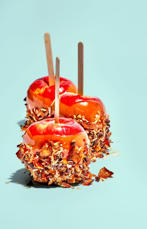 Editorial food photography featuring caramel dipped apples with coconut and bacon crust. Shot for Moinked Magazine. © Copyright Suzanne Clements. All Rights Reserved. #caramel #apple #Fall #food #sweet #treat #onastick #caramelapple #dessert #bacon Caramel Apple Photography, Caramel Dipped Apples, Venchi Chocolate, Dipped Apples, Apples Photography, Apple Caramel, Caramel Dip, Caramel Desserts, Shot Ideas