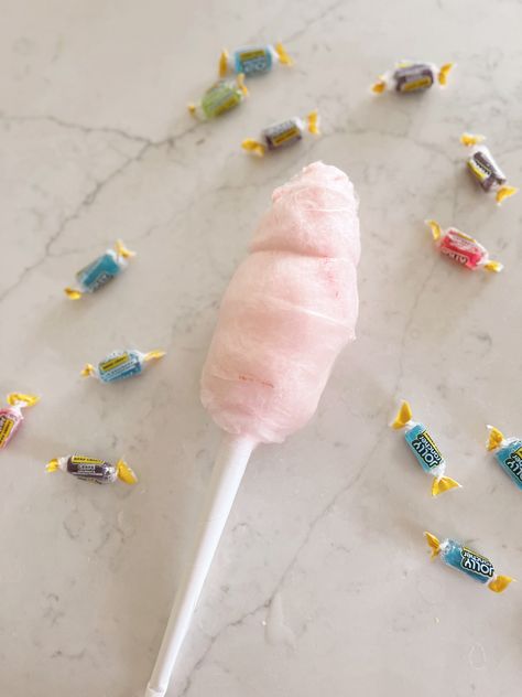 Cotton candy on a counter surrounded by jolly rancher candies. Jolly Rancher Cotton Candy Microwave, Easy Cotton Candy Recipe, Cotton Candy Sugar Recipe, Jolly Rancher Cotton Candy, Homemade Cotton Candy Sugar, Diy Cotton Candy Sugar, Cotton Candy Recipes, Making Cotton Candy, Cotton Candy Recipe