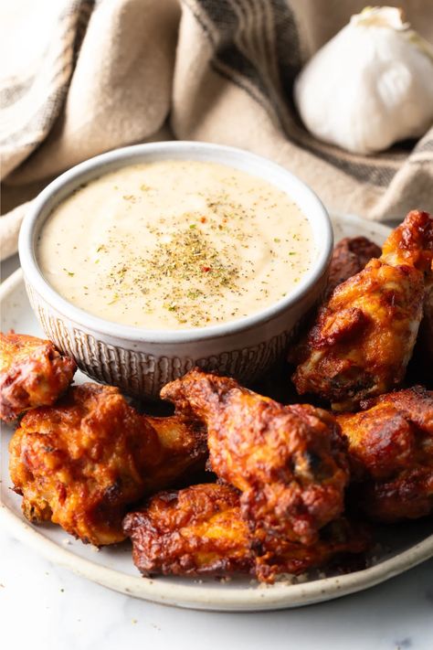 Imagine biting into a juicy, perfectly cooked chicken wing that's bursting with flavor. The rich taste of parmesan cheese meets the a symphony of garlic, creating a sauce that complements the crispy crust and tender meat. With this irresistible wing sauce in hand, you're bound to become the MVP of any party or gathering. Chicken Wings Dip, Wings Dipping Sauce, Garlic Parmesan Sauce Recipe, Parmesan Sauce Recipe, Italian Seasoning Recipe, Chicken Wing Dip, Creamy Garlic Parmesan Sauce, Southern Comfort Recipes, Christmas Main Dishes