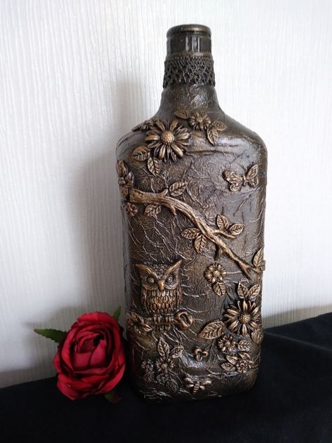 Wine Bottles In The Garden, Steampunk Bottle Art, Bottles In The Garden, Altered Bottles Diy, Steampunk Bottles Diy Ideas, Diy Crafts Vases, Altered Bottles Tutorial, Altered Bottles Diy Mixed Media, Glass Skull Bottle Ideas