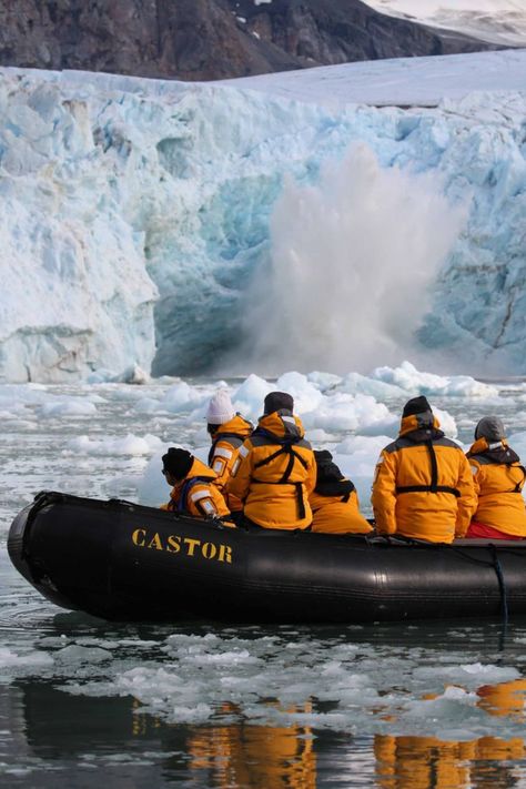 Clients in their yellow polar jackets sit on zodiac boat and watch as the Glacier Wall in front of them calves - and the ice falls into the water creating a big splash.
Arctic travel - Unique Destinations Arctic Cruise, Arctic Expedition, Unique Experiences, Future Life, Outdoor Activities, Travel