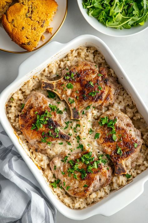 Explore the delicious flavors of our savory pork chop and rice casserole recipe! This hearty dish combines juicy pork chops, tender rice, flavorful seasonings, and a cheesy topping for a satisfying meal that the whole family will love. Perfect for busy weeknights or special occasions, this easy-to-make casserole is sure to become a go-to favorite in your recipe collection. Pork Loin With Rice Recipes, One Dish Pork Chops And Rice, Pork Chop Wild Rice Casserole, Swiss Pork Chop Casserole, Pork Chop And Rice Casserole With Lipton Onion Soup, One Dish Pork Chop Meals, Pork Chop Casserole Recipes Rice, Oven Pork Chops And Rice, Oven Baked Pork Chops And Rice