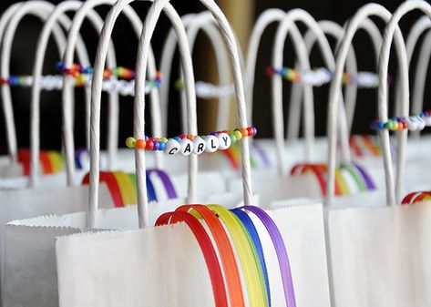 Rainbow party favor bags and bracelets Rainbow Dash Party, Girl Scout Bridging, Rainbow Party Favors, Rainbow Unicorn Party, Girl Scout Daisy, Rainbow Theme Party, Daisy Scouts, Backless Shirt, Rainbow Parties