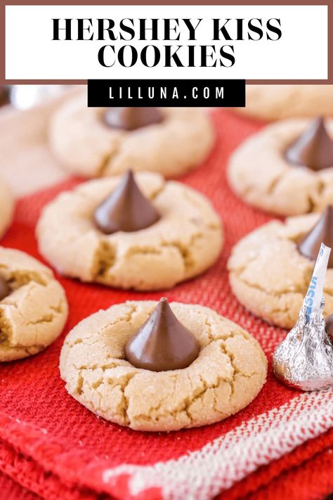 Hershey Kiss cookies are soft, chewy peanut butter cookies topped with a tasty chocolate kiss! It's a best-loved simple cookie recipe. #peanutbuttercookies #kisscookies #cookies #peanutbutter #hersheyskiss Peanut Butter Hershey Kiss Cookies, Peanut Butter Kiss Cookies Recipe, Bisquick Cookies, Simple Cookie Recipe, Hershey Recipes, Kiss Cookie Recipe, Peanut Butter Blossoms Recipe, Hershey Kiss Cookies, Peanut Butter Kiss