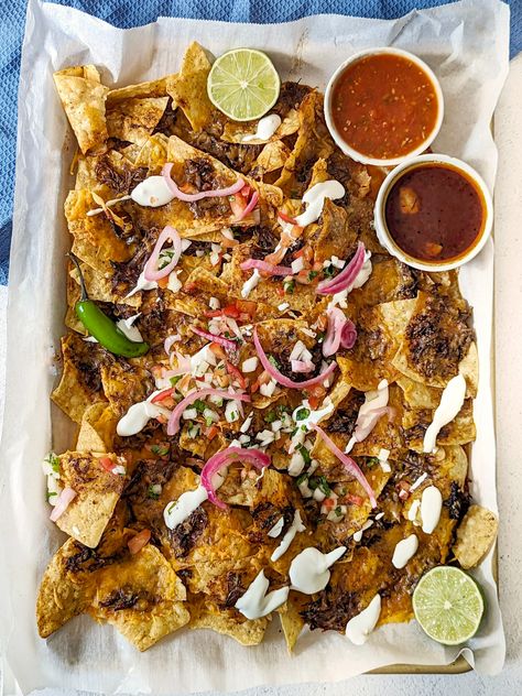 Birria Nachos – Are you looking for a twist on classic nachos? Spice up boring tortilla chips with our mouth-watering Birria Nachos recipe- loaded with tender shredded beef, gooey cheese, … The post Birria Nachos appeared first on Jamil Ghar. Birria Nachos, Classic Nachos, Nacho Toppings, Fall Favorites Recipes, Homemade Nachos, Hearty Casseroles, American Recipes, Supper Ideas, Favorite Recipes Dinner