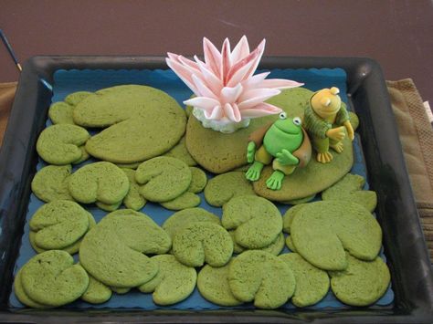 a cake with frog and toad as the theme. Lily pad pancakes/cookies? Green Sugar Cookies, Frog Food, Pond Cake, Princess Tiana Birthday Party, Tiana Birthday Party, Frog Cookies, Frog Baby Showers, Frog Birthday Party, Leap Year Birthday